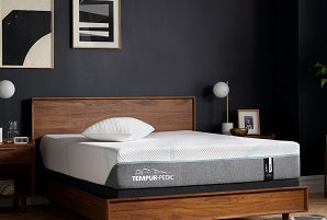 Tempur-pedic mattress in room on bedframe