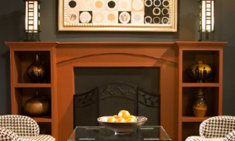 A mantel with vases, lamps, and wall art