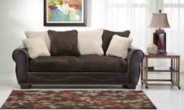 A faux leather brown sofa in a living room