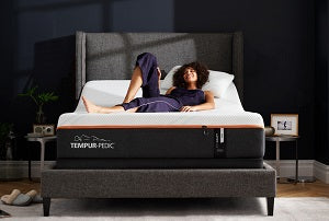 Woman laying on a tempur-pedic mattress