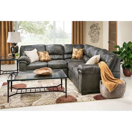 Living room with leather sectional, throw pillows, and coffee table