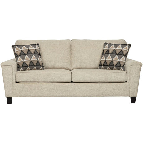 Tan sofa with throw pillows