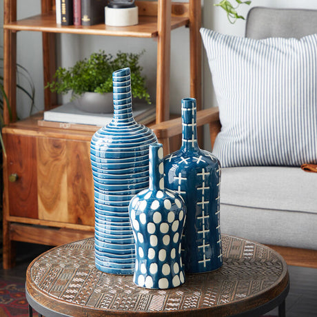 Three matching blue vase