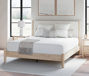 Cadmori Upholstered Panel Bed queen size in room