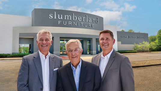 Slumberland owners and president in front of Eagan store