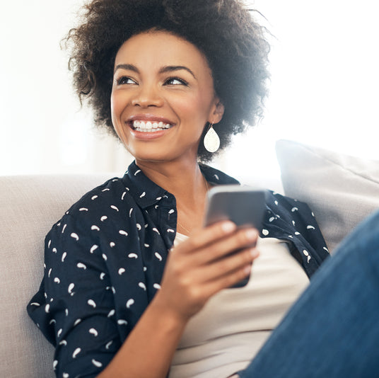 woman on phone smiling