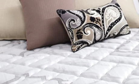 Pillows and bedding on a mattress