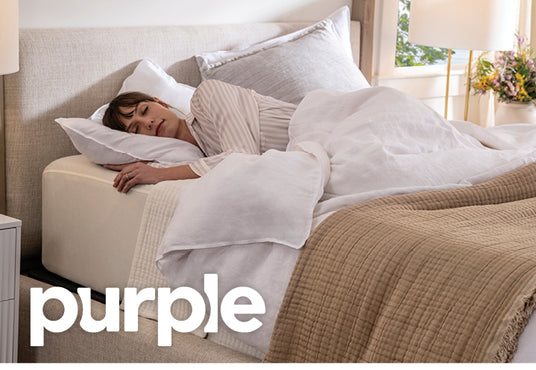 Woman sleeping on Purple pillow in bedroom