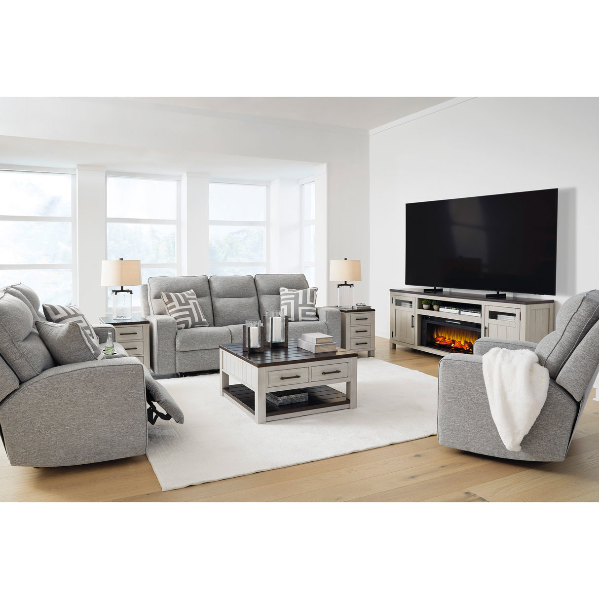 Biscoe Dual Power Reclining Sofa in living room with loveseat and recliner