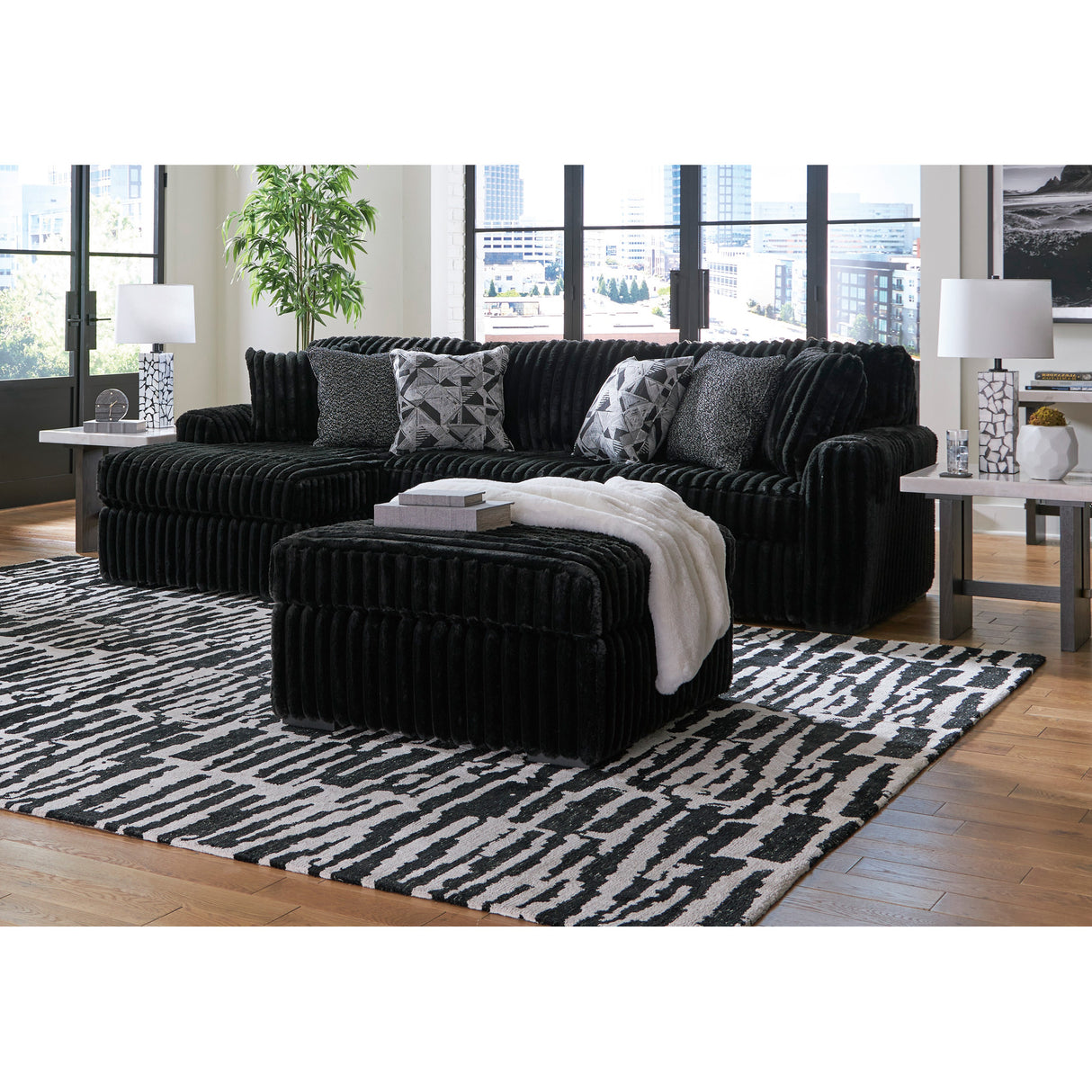 Midnight Madness 2 Piece Left Chaise Sectional with ottoman in room