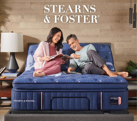 Couple laying on stearns and Foster Lux Estate mattress