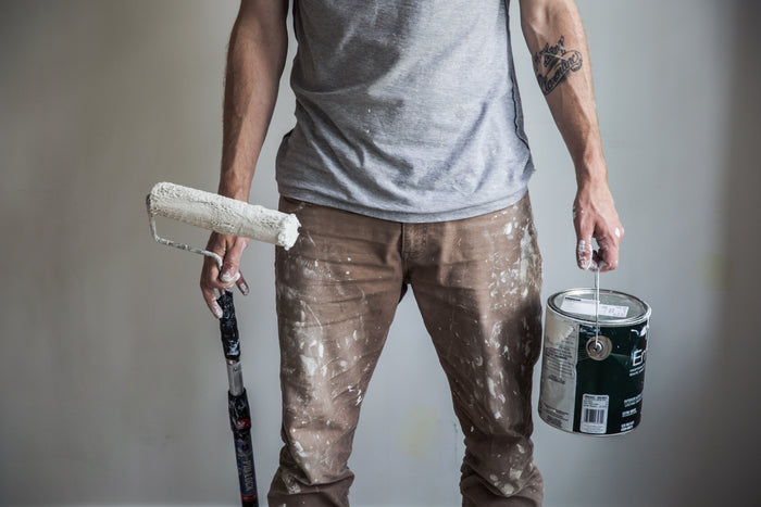 painter with paint can and roller