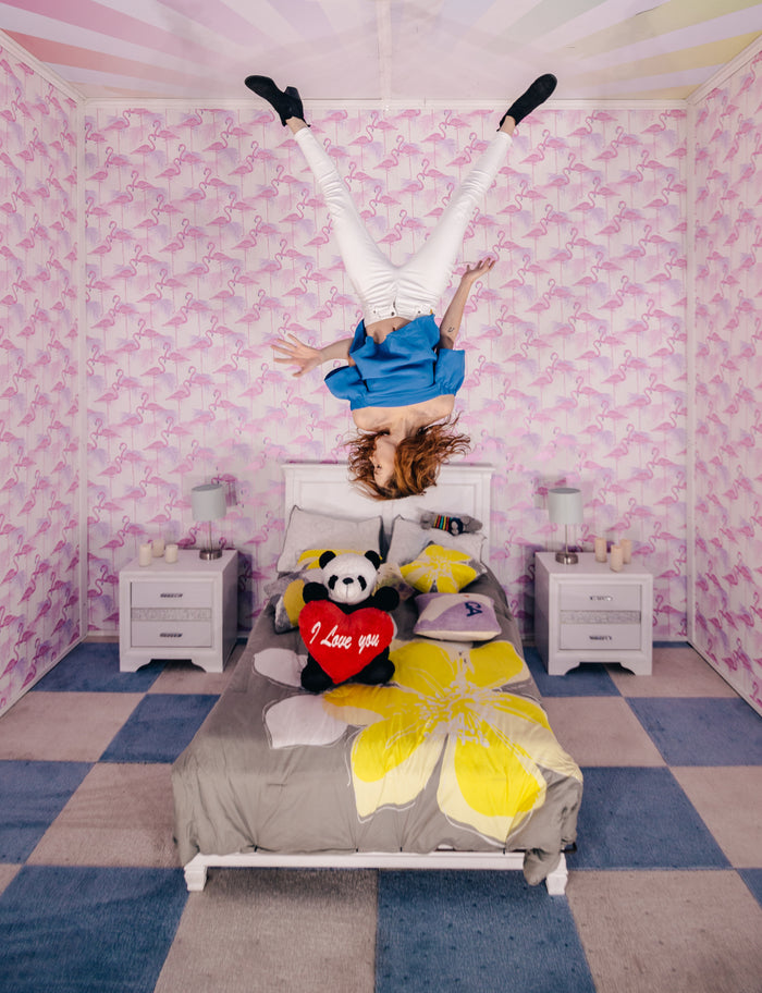 image of a bedroom with upside down person